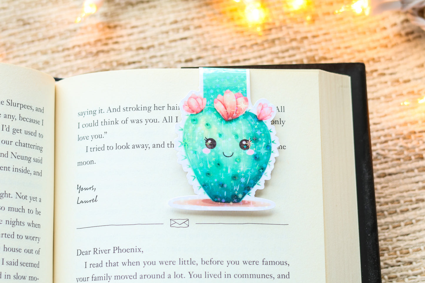 an open book with a picture of a cactus on it