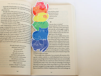 Bookmark featuring a stack of cats, each in a different color of the rainbow