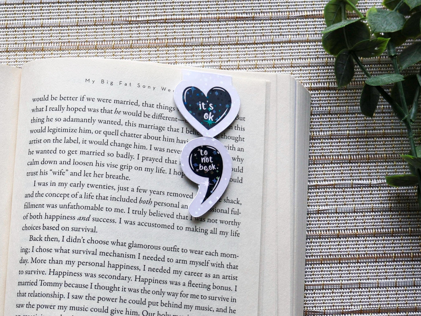 Magnetic bookmark in the shape of a semicolon made with a heart with text that reads &quot;it&#39;s ok to not be ok.&quot; Black and white