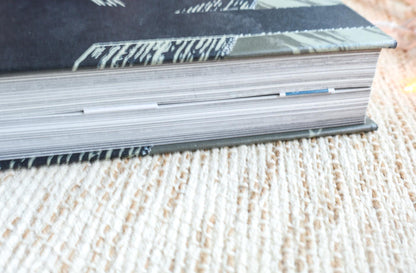 a stack of books sitting on top of a table