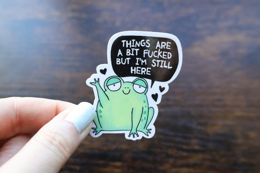 Frog with speech bubble &quot;things are a bit fucked but I&#39;m still here&quot;